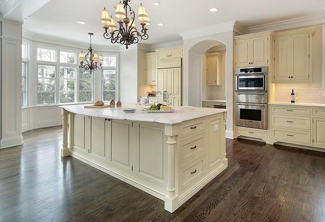 newly installed grey laminate flooring in modern kitchen in Belle Glade, FL